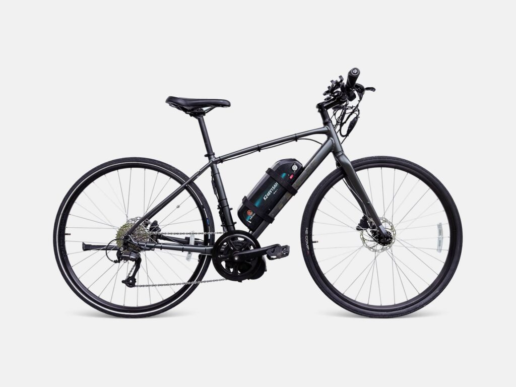 Studio photo of a silver Trek FX2 E-Bike equipped with a Bafang mid-drive motor, offered for effortless e-bike touring in Southeast Asia.