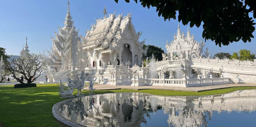 The Wat Rong Khun (White Temple) in Chiang Rai, a prominent cultural highlight on our Northern Thailand cycling tours.