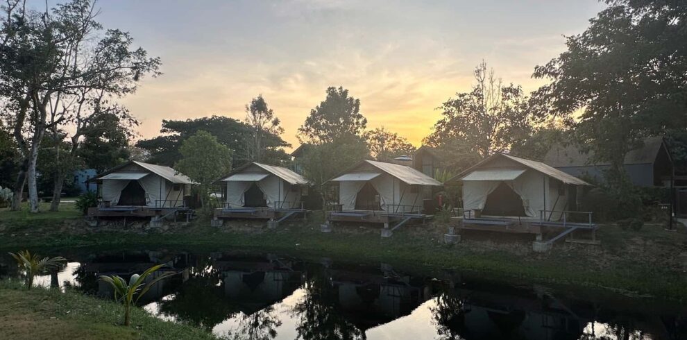 Luxury tented villas at a serene riverside resort in Kaeng Krachan, part of our hand-picked cycling tour accommodations.