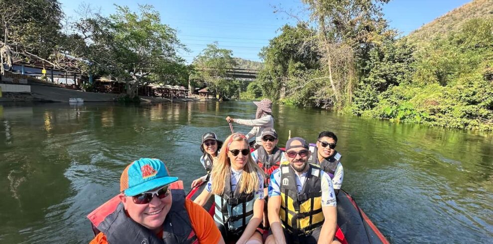 Cycling tour participants enjoying a river rafting excursion in Kaeng Krachan National Park during the Hua Hin Explorer Tour.