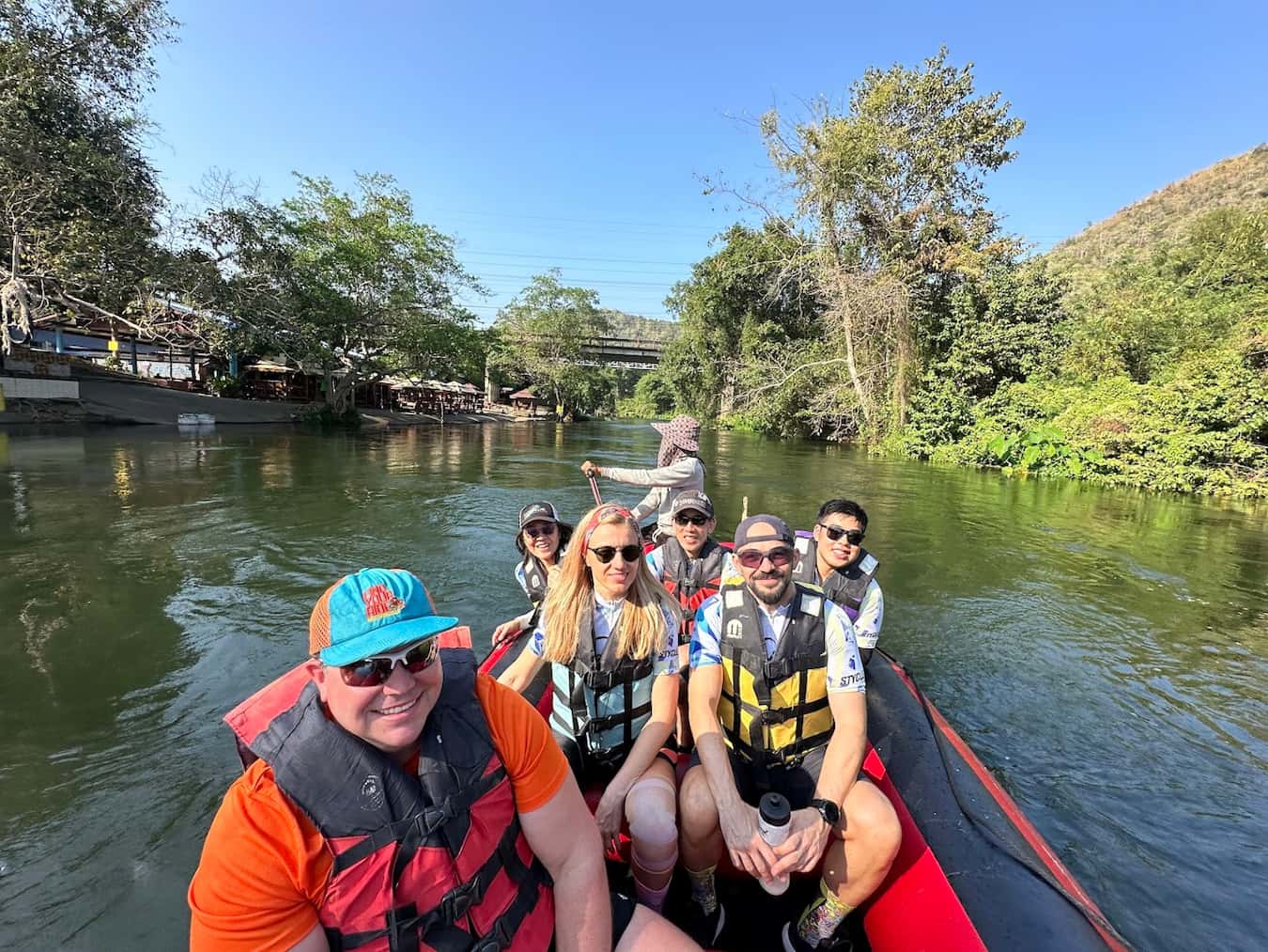 Cycling tour participants enjoying a river rafting excursion in Kaeng Krachan National Park during the Hua Hin Explorer Tour.