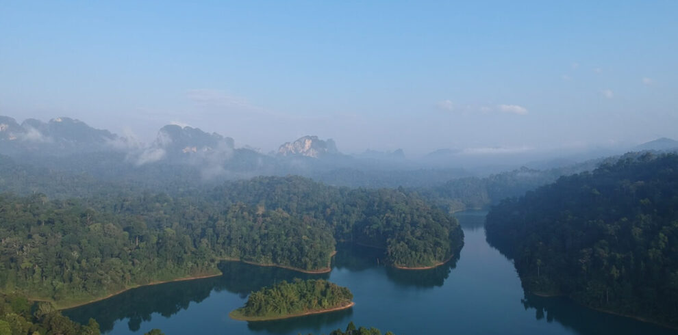 Stunning view of karst mountains and emerald water at Khao Sok National Park on a Thailand Cycle Tours route.