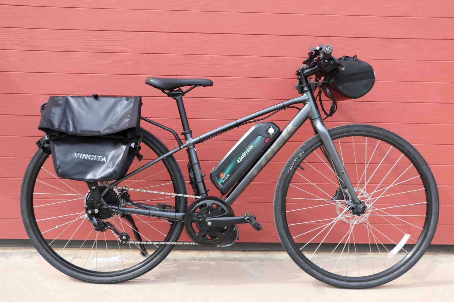 E-touring bike for self-guided tours with Thailand Cycle Tours, equipped with a rear bike rack, pannier bags, and electric pedal assistance, ideal for exploring Thailand’s scenic countryside, coastal routes, and multi-day cycling adventures in comfort.