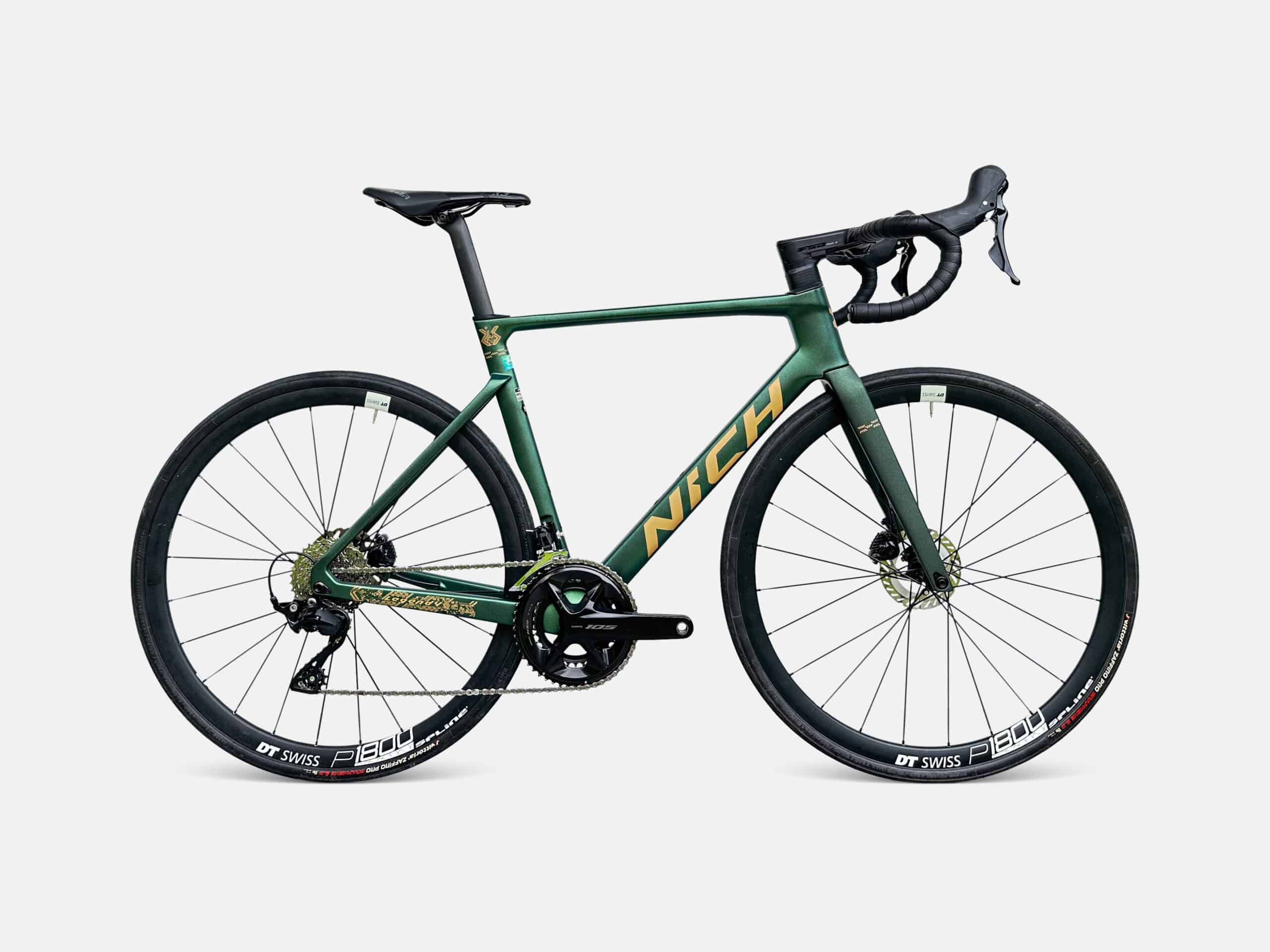 Studio photo of the lightweight Nich Carbon Legend 4 road bike featuring hydraulic disc brakes, available for tour rentals.