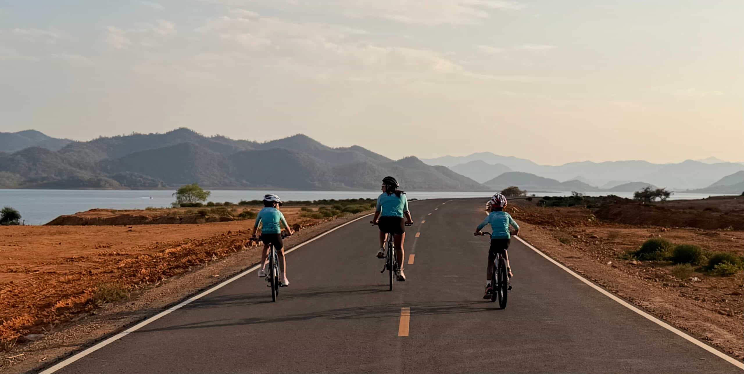 Family cycling adventure holidays in Thailand with Thailand Cycle Tours, featuring parents and children riding together through tropical landscapes, quiet coastal roads, national parks, and beautiful beaches on fun and memorable family-friendly bike tours.