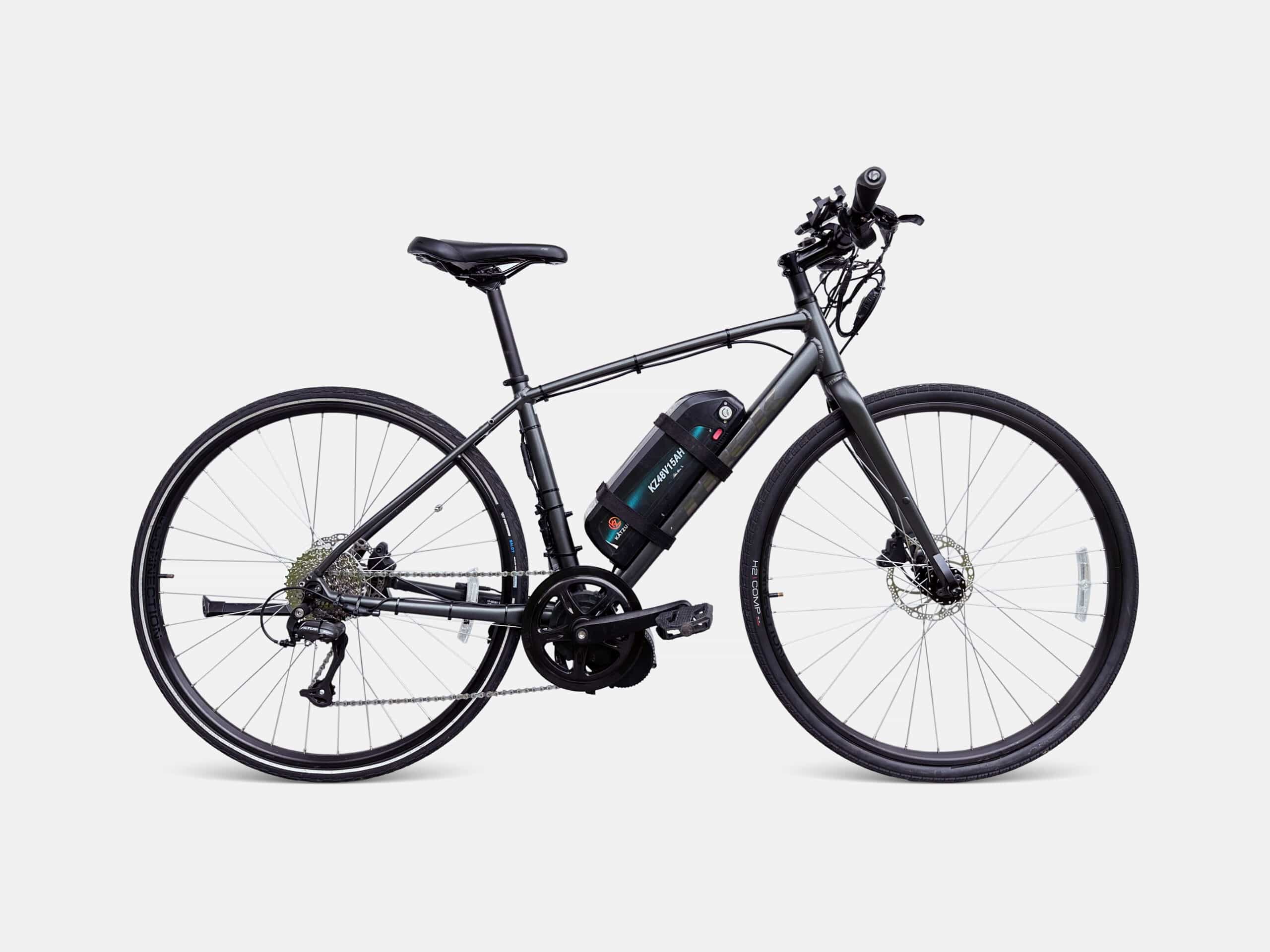 Studio photo of a Trek FX2 hybrid electric bike equipped with a Bafang mid-drive motor.