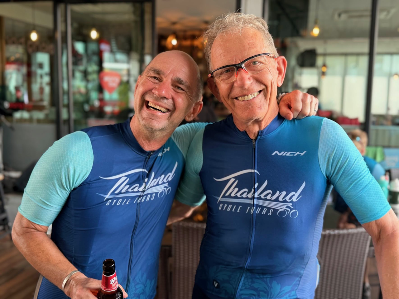 Happy cyclists smiling during a Thailand Cycle Tours adventure, enjoying scenic rides through Thailand’s beautiful landscapes, tropical countryside, coastal roads, and cultural highlights on a memorable cycling holiday.